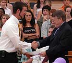 Jared collects the JFK Award for Excellence in Science from Mr. Leddy